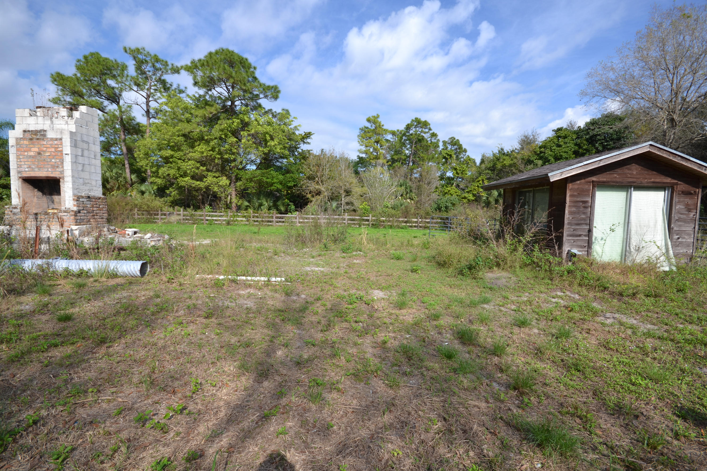 3320 C Road Loxahatchee, FL 33470 - Photo 9 of 15 a view of a yard in front of a house