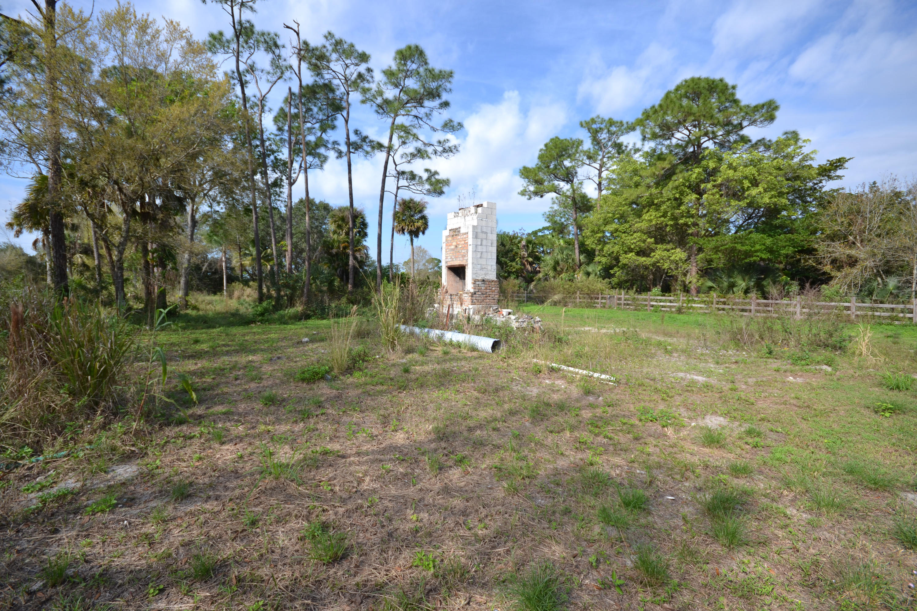 3320 C Road Loxahatchee, FL 33470 - Photo 10 of 15 a view of a garden with a fountain
