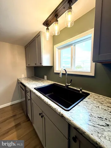 a kitchen with a sink and a window