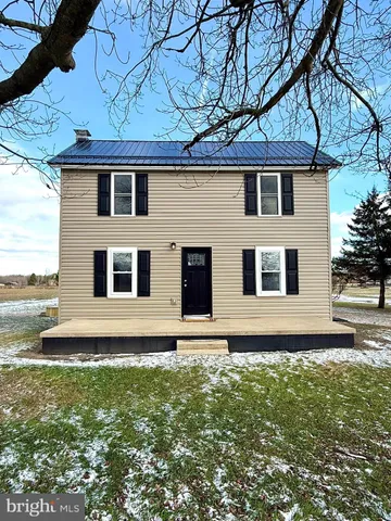 a house view with a garden space