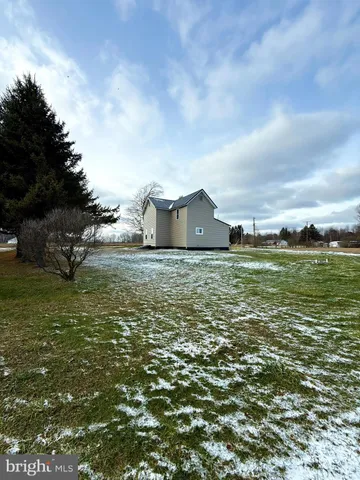 a view of a large body of water with a building in the background