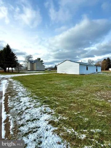 a view of a large body of water with a building in the background