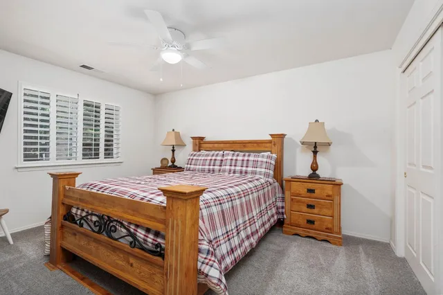 a bedroom with a bed and a dresser