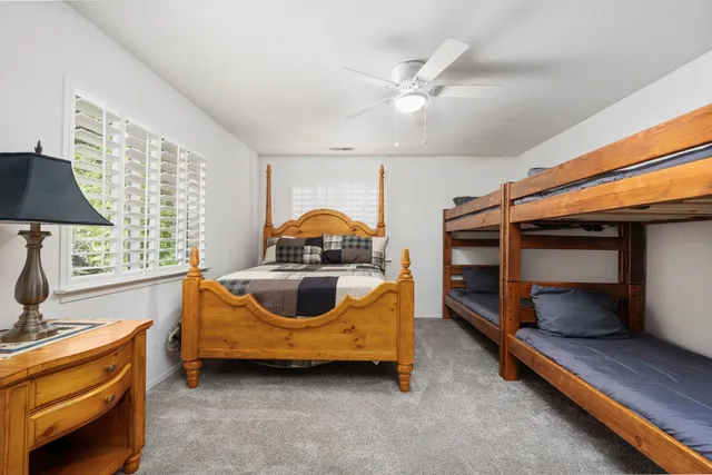 a bedroom with bed and a window