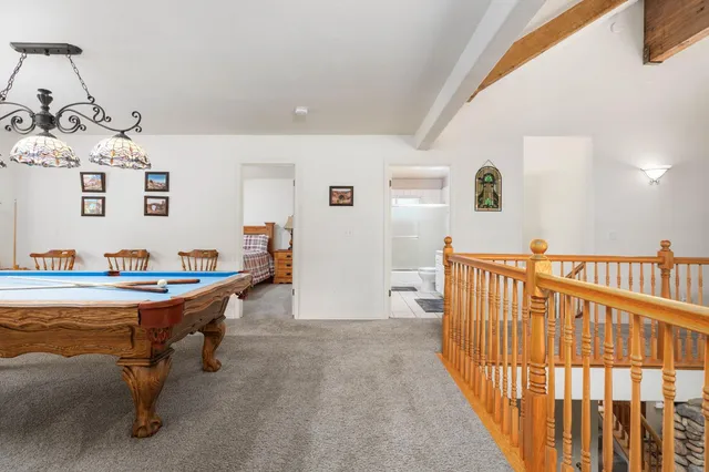 a view of a bedroom with furniture