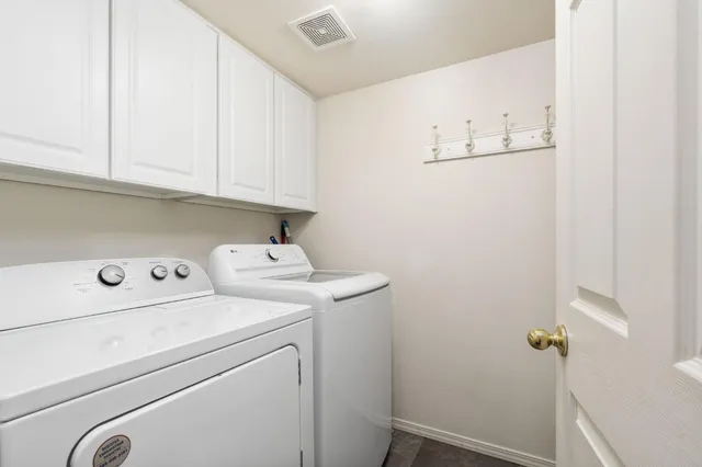 a view of storage and utility room with washer and dryer