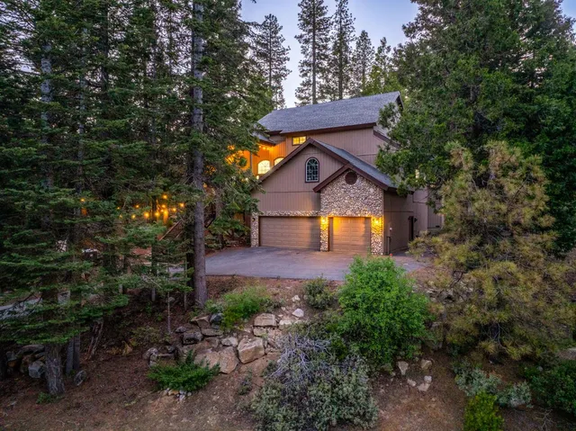 a front view of a house with garden