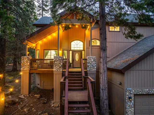 a view of a pathway of a house along with stairs and a street