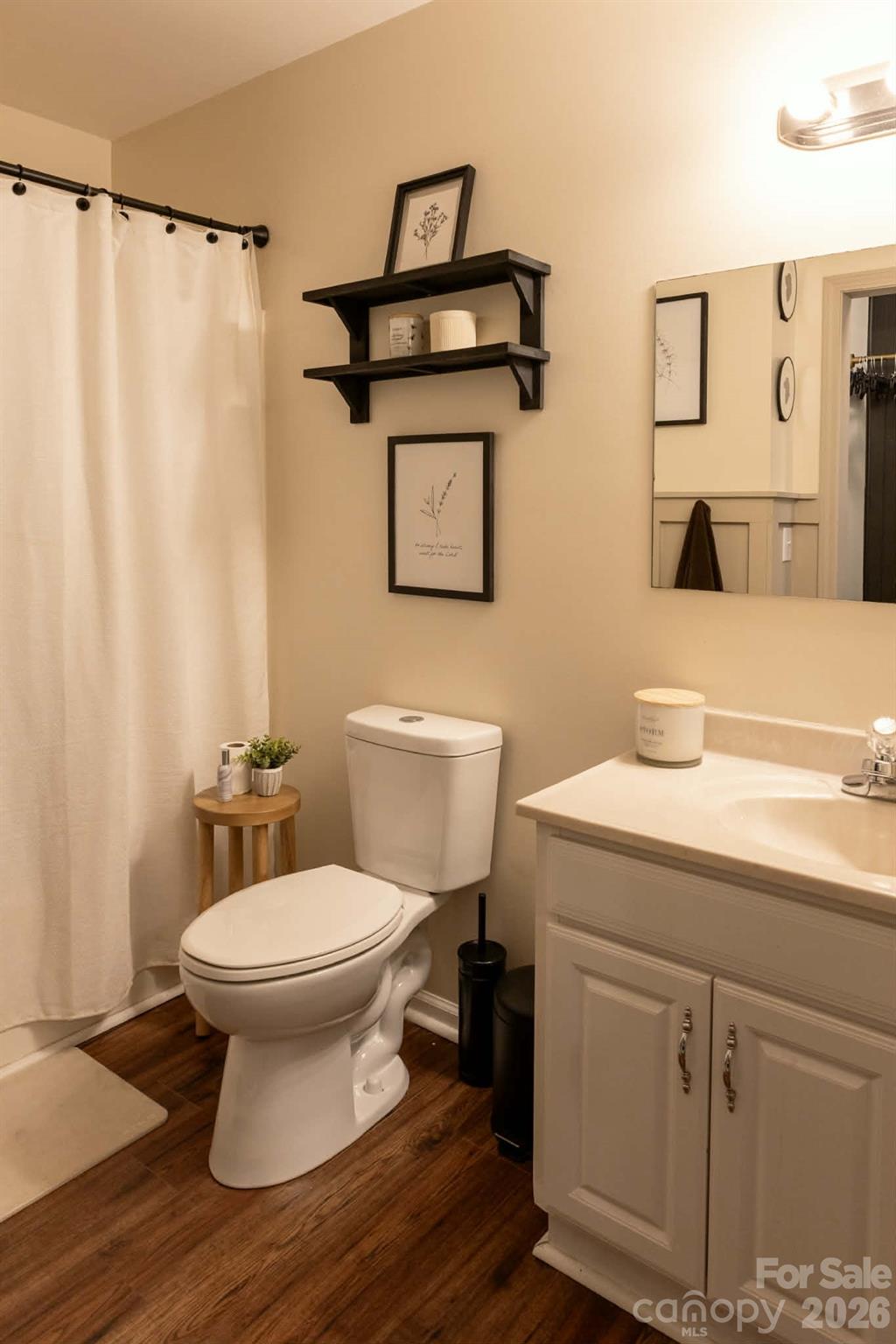 202 East Rice Street Landis, NC 28088 - Photo 16 of 23 a bathroom with a toilet sink and mirror