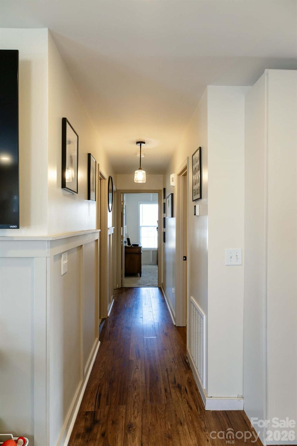 202 East Rice Street Landis, NC 28088 - Photo 20 of 23 a view of a hallway with wooden floor and cabinets