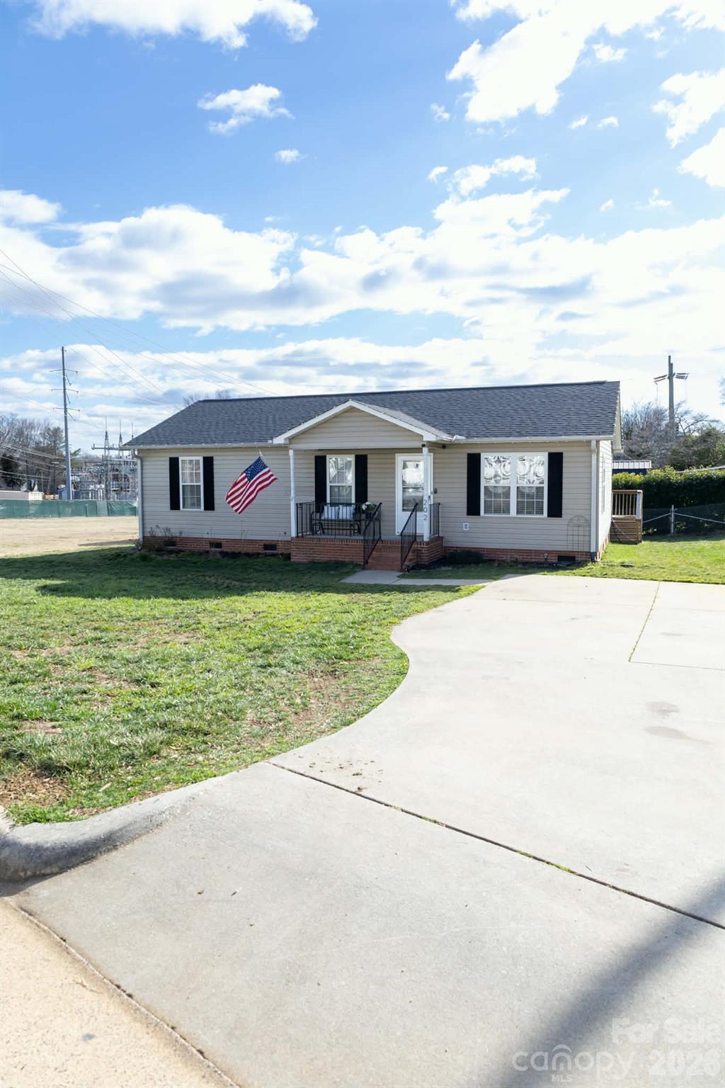 202 East Rice Street Landis, NC 28088 - Photo 2 of 23 a view of a house with a big yard and potted plants
