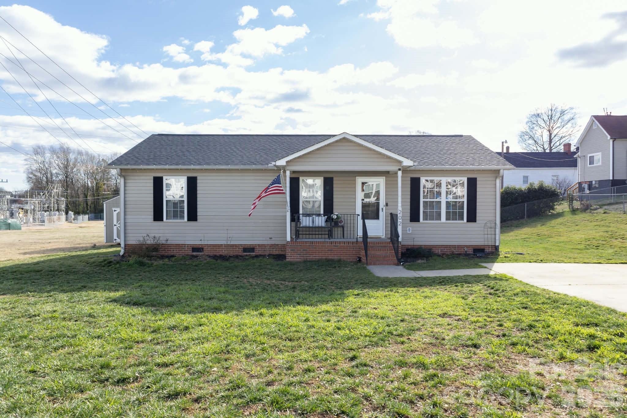 202 East Rice Street Landis, NC 28088 - Photo 3 of 23 a house view with a garden space