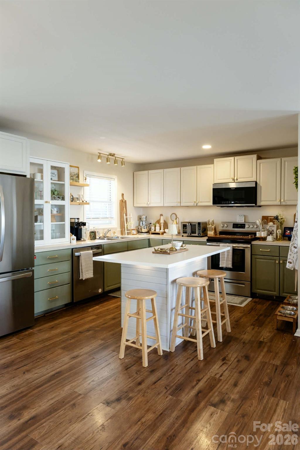 202 East Rice Street Landis, NC 28088 - Photo 6 of 23 a kitchen with a refrigerator a counter top space a sink and cabinets