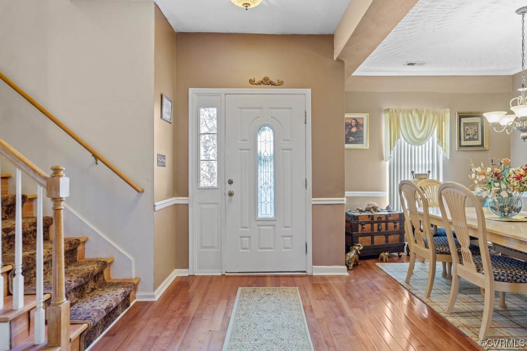 foyer area with hardwood floors