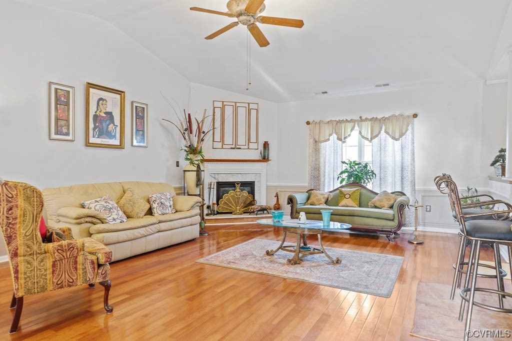 Living room, fireplace, vaulted ceiling, hardwood flrs. chair molding