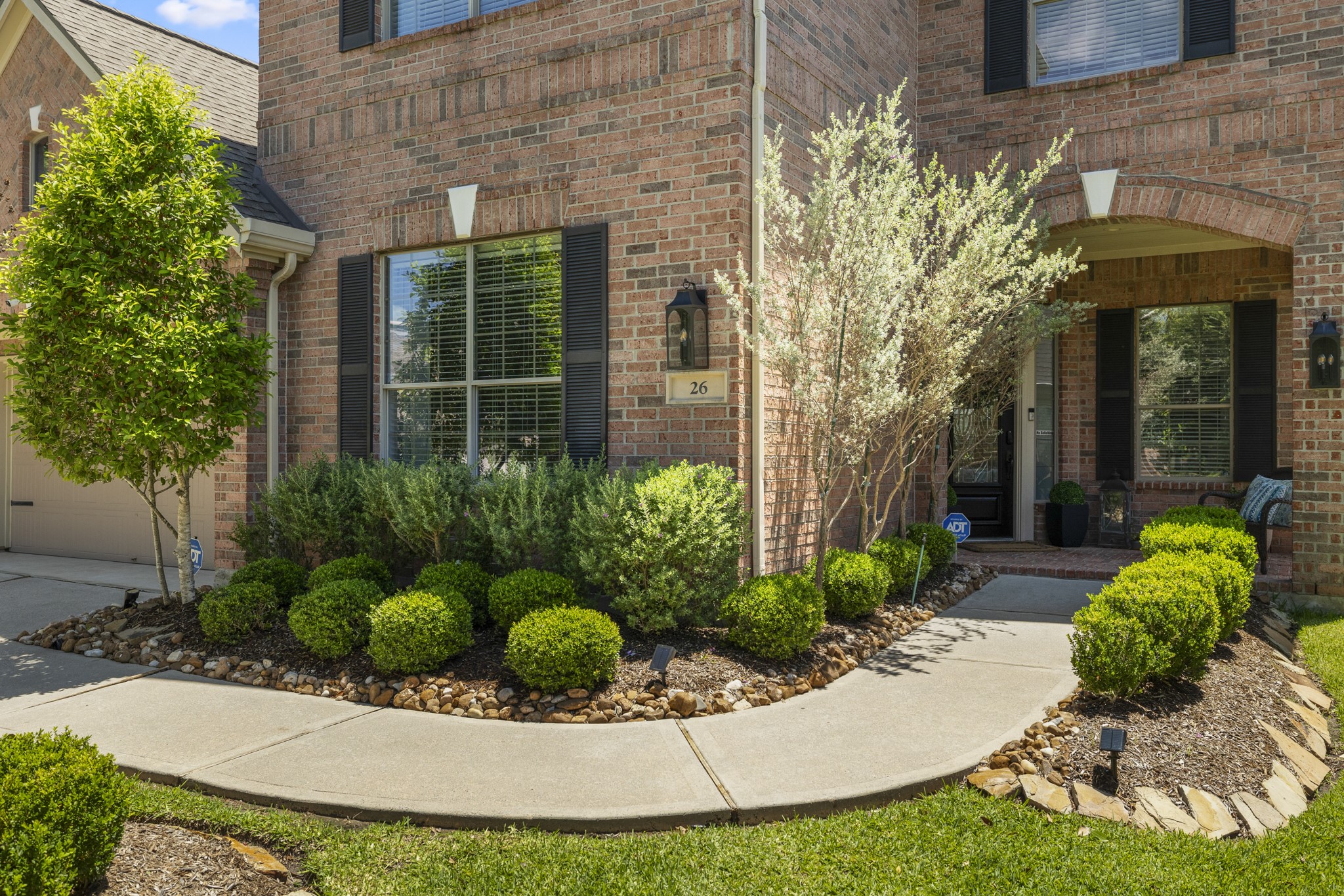 26 Winhall Place The Woodlands, TX 77354 - Photo 3 of 49 a view of a garden with potted plants