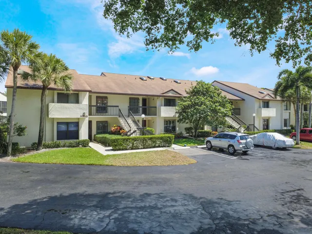 a view of a parked cars in front of a house