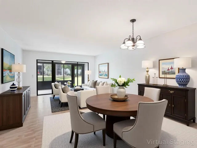 a view of a dining room with furniture wooden floor and chandelier