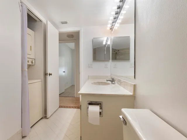 a bathroom with a sink and mirror