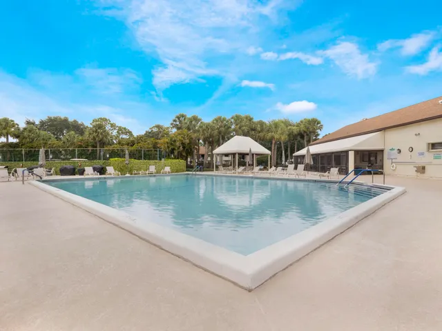 a view of swimming pool with a lake view