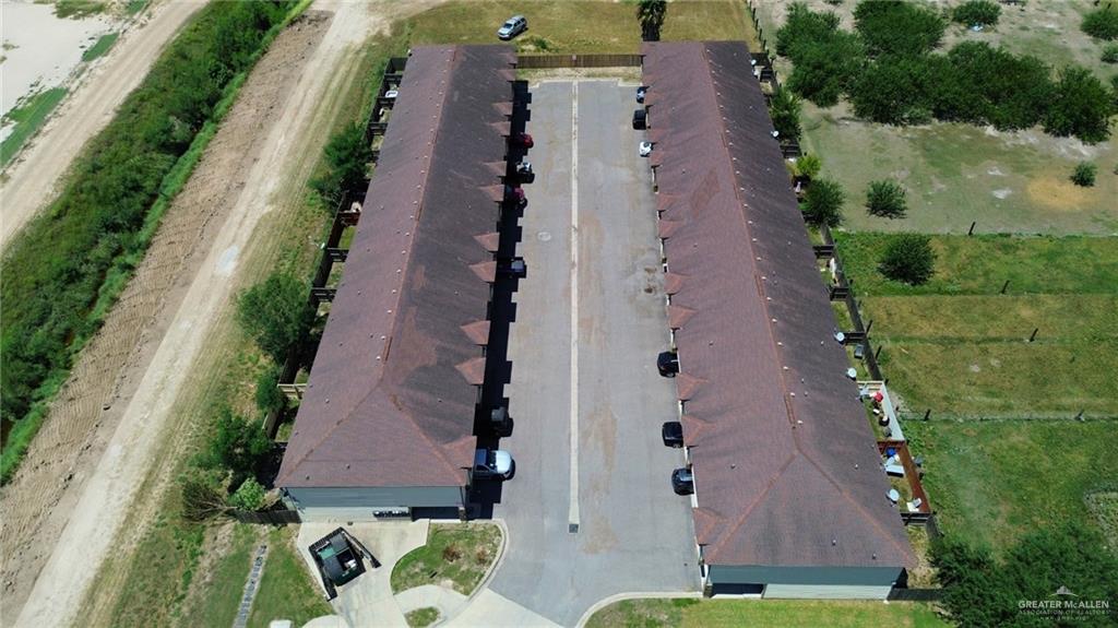 1500 Humming Bird Court, Unit 4 Pharr, TX 78577 - Photo 23 of 26 an aerial view of house with yard