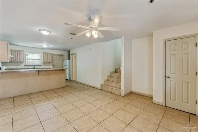 a view of a kitchen with cabinet and a window