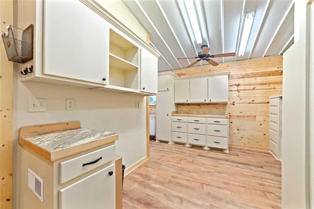 a view of a dresser and storage cabinet