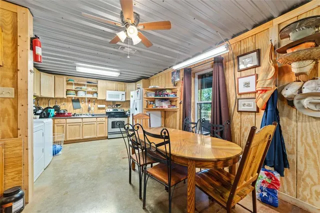 a kitchen with a stove and white cabinets