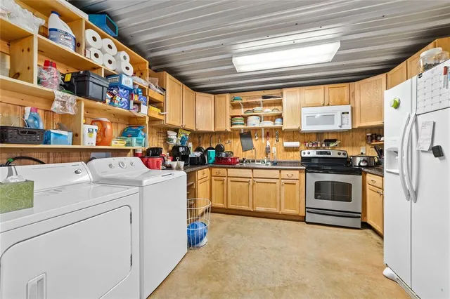 a bedroom with bed and a chandelier