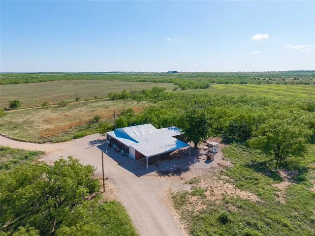 a view of a terrace with a table and chairs