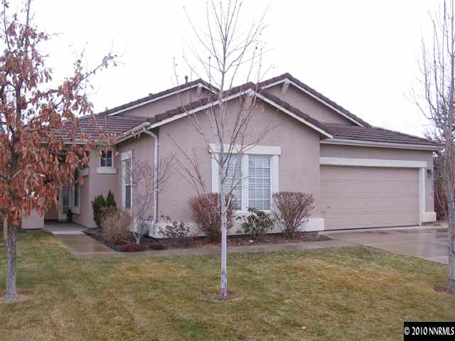 1310 Arbor Court Reno, NV 89521 - Photo 1 of 9 a backyard of a house with table and chairs