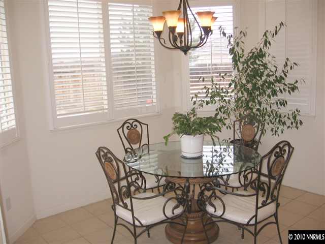 1310 Arbor Court Reno, NV 89521 - Photo 6 of 9 a dining room with furniture and window