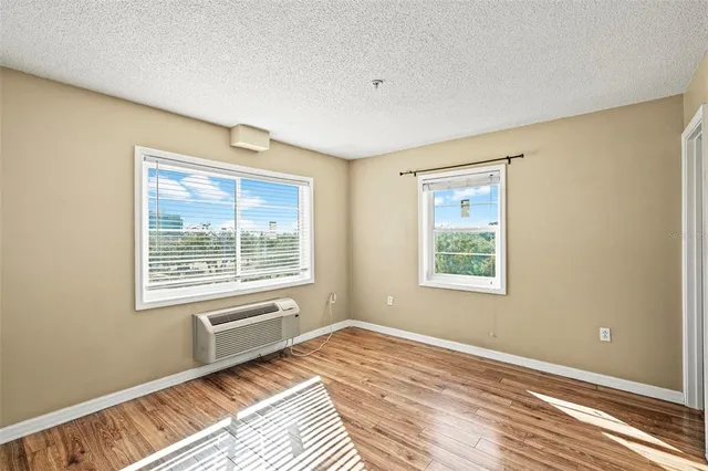 a view of an empty room with a window