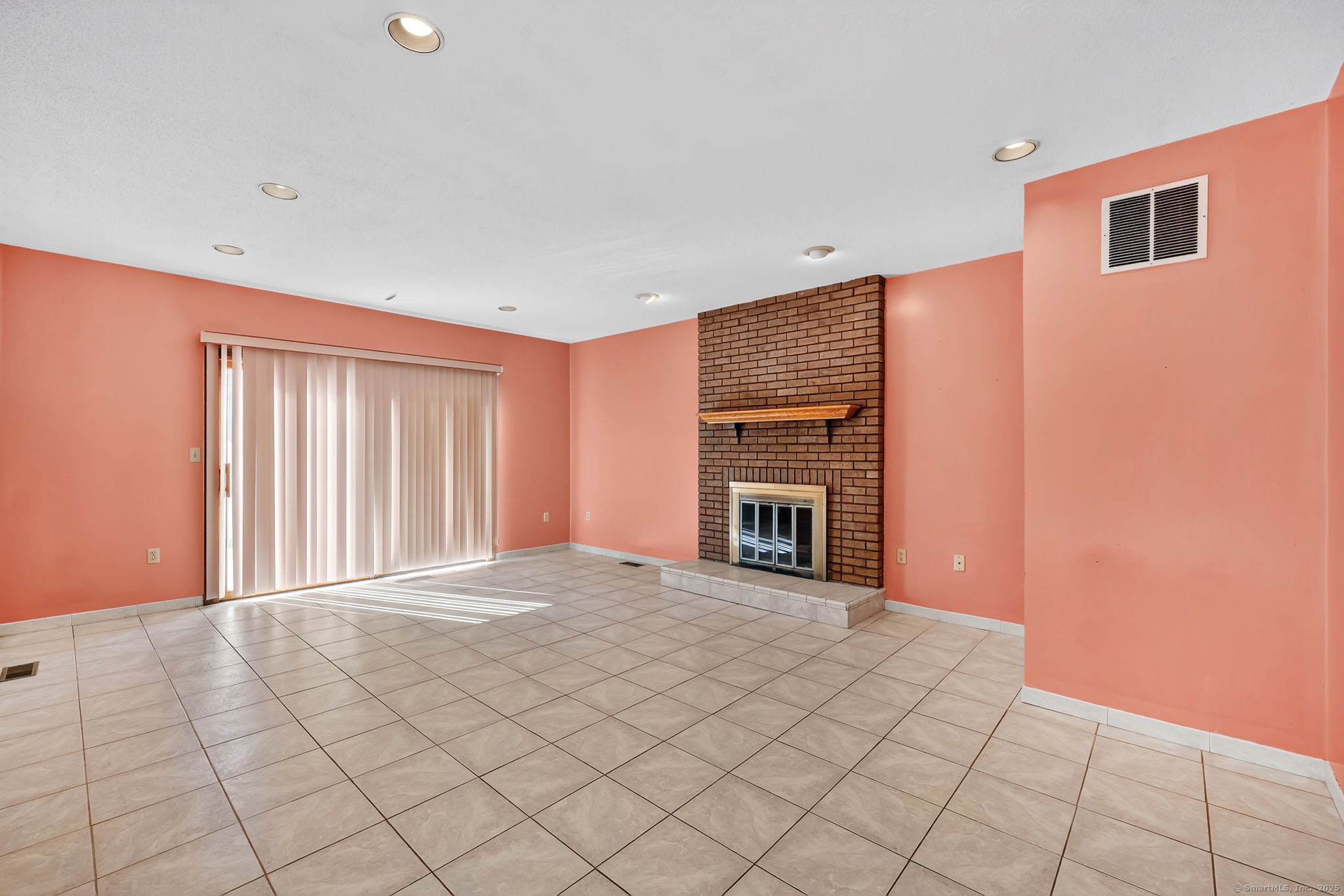 208 Highmeadow Lane Middletown, CT 06457 - Photo 20 of 34 a view of an empty room with a fireplace and a window