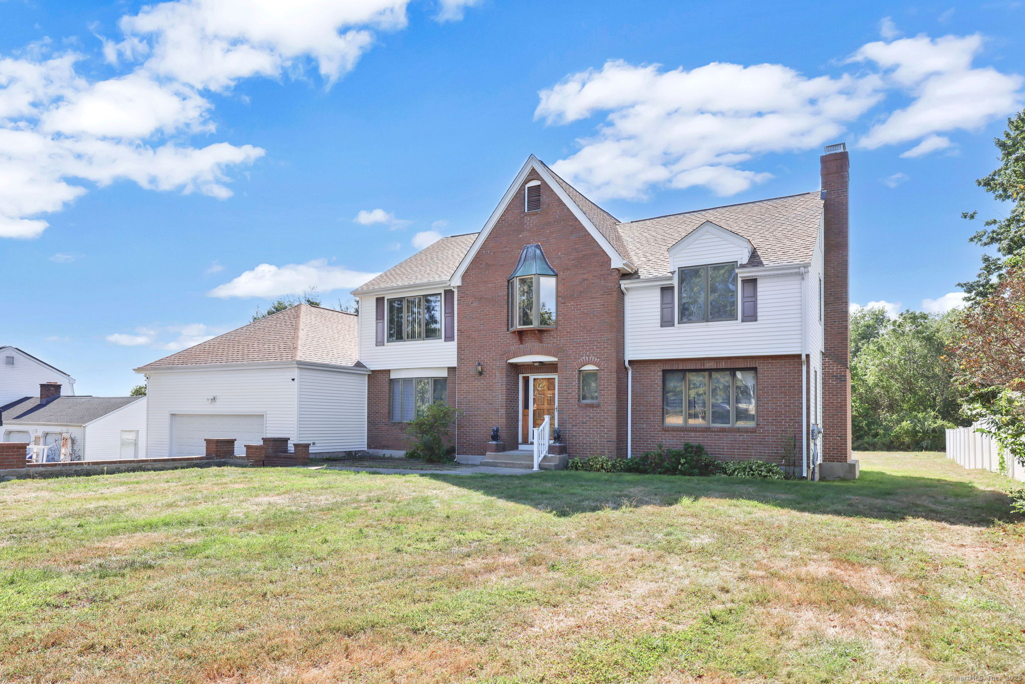 208 Highmeadow Lane Middletown, CT 06457 - Photo 2 of 34 a front view of a house with a yard