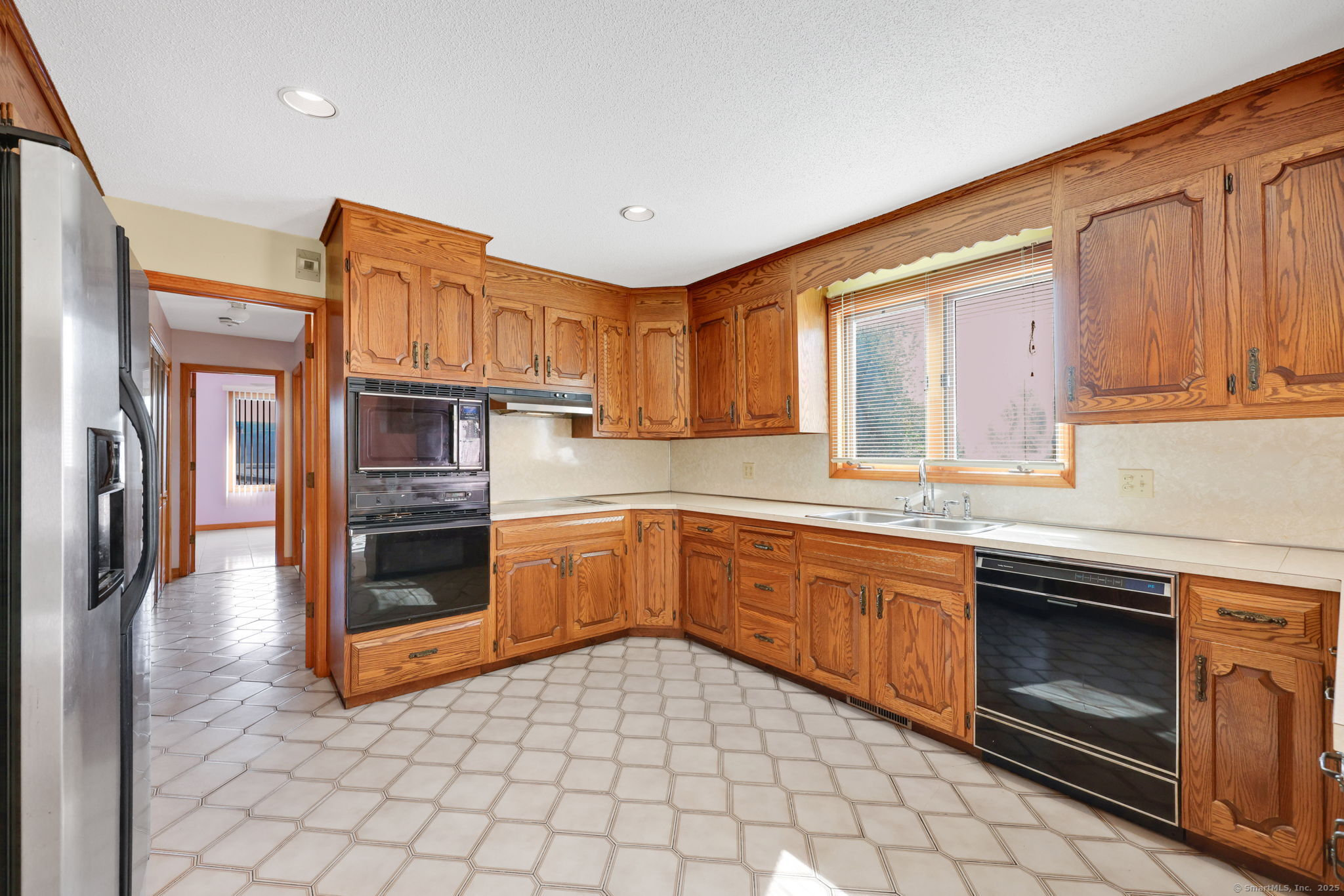 208 Highmeadow Lane Middletown, CT 06457 - Photo 22 of 34 a kitchen with stainless steel appliances granite countertop a stove a sink and a microwave