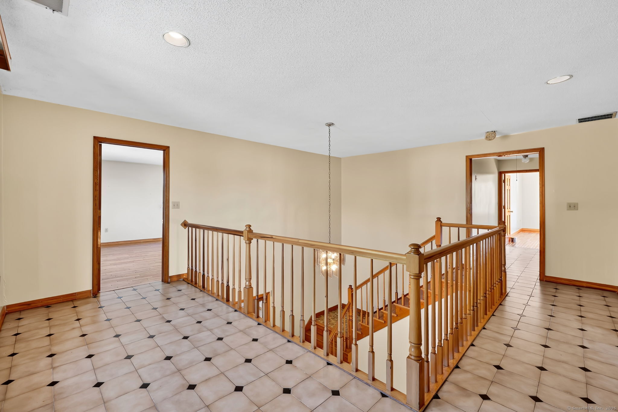 208 Highmeadow Lane Middletown, CT 06457 - Photo 29 of 34 a view of a hallway with wooden floor and staircase