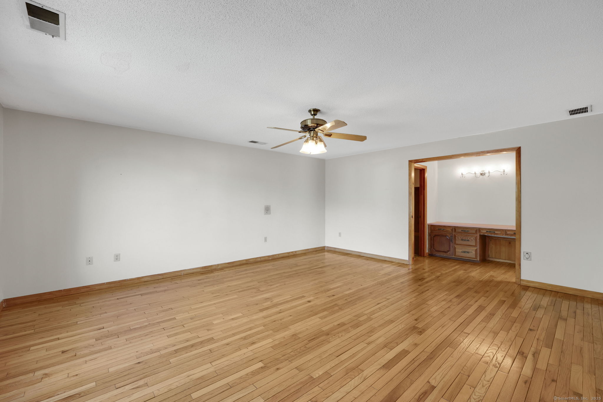 208 Highmeadow Lane Middletown, CT 06457 - Photo 3 of 34 a view of an empty room with wooden floor