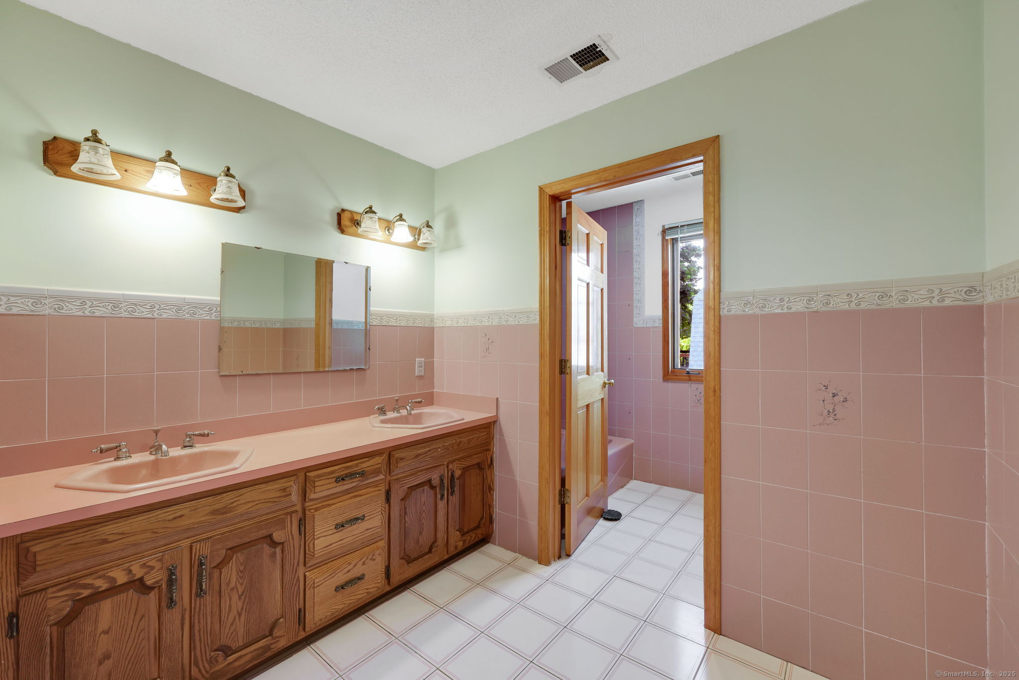 208 Highmeadow Lane Middletown, CT 06457 - Photo 32 of 34 a spacious bathroom with a double vanity sink a mirror and a shower
