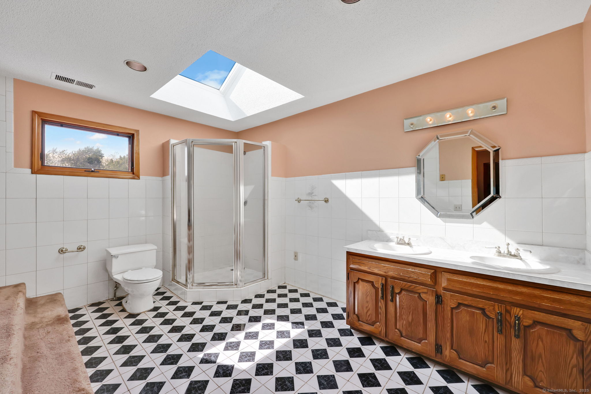 208 Highmeadow Lane Middletown, CT 06457 - Photo 7 of 34 a bathroom with a sink a toilet and mirror