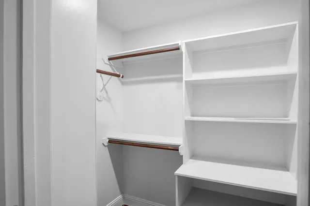 a bathroom with a toilet and shower