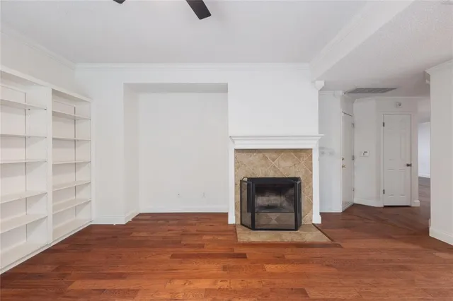 a kitchen with granite countertop a stove a sink a center island and windows