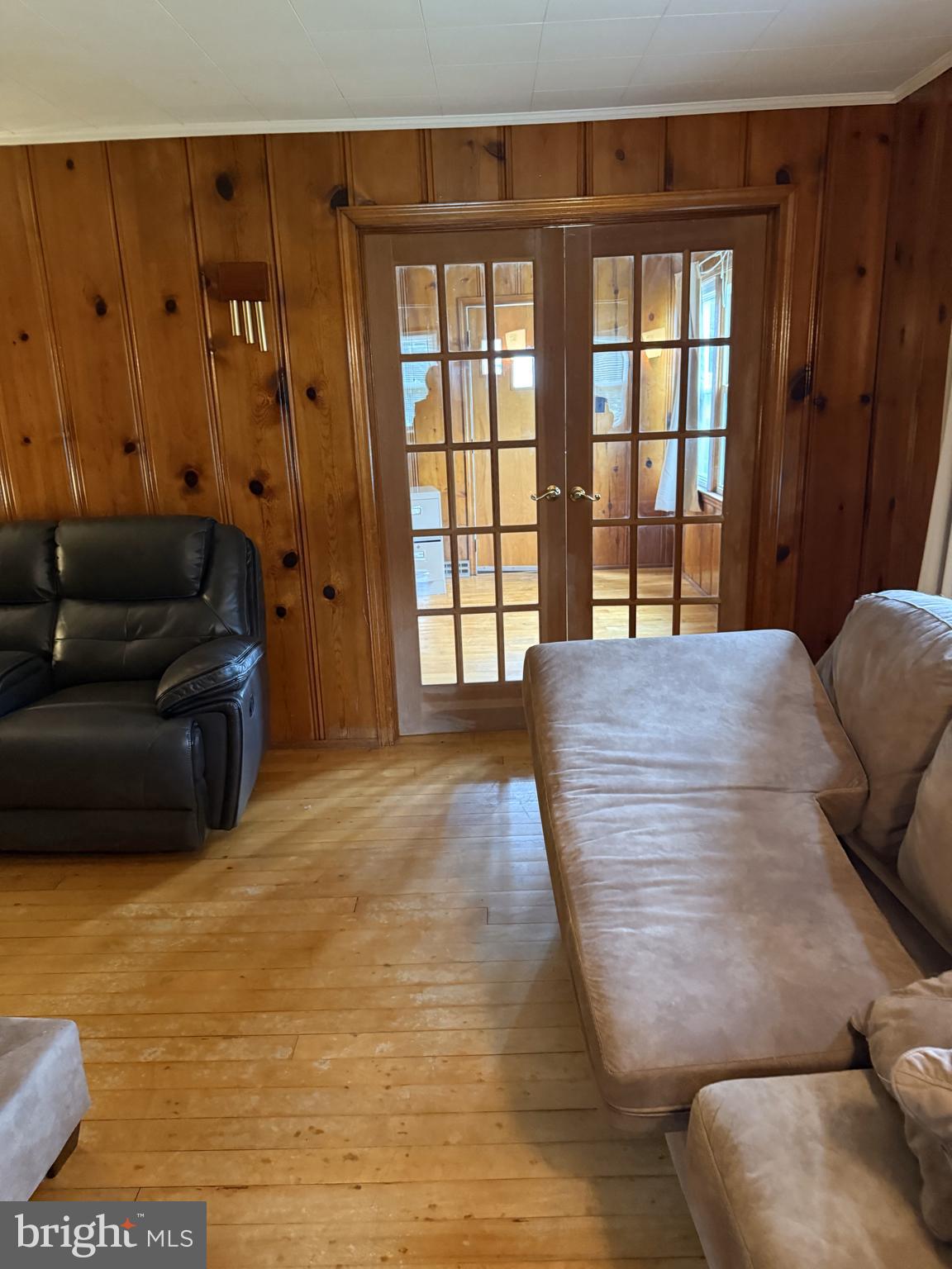 4870 Calvert Drive St. Leonard, MD 20685 - Photo 8 of 10 a living room with furniture and large windows