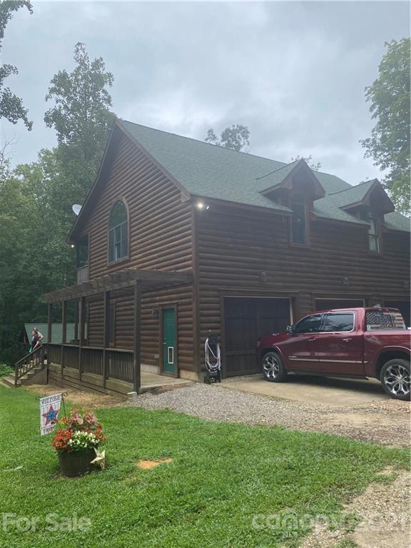 4480 Amity Hill Road Cleveland, NC 27013 - Photo 1 of 1 a front view of a house with a garden
