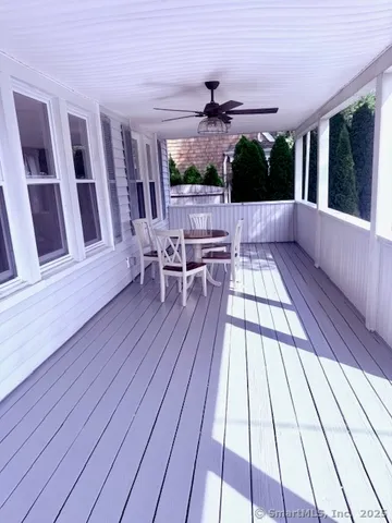 a view of balcony with furniture