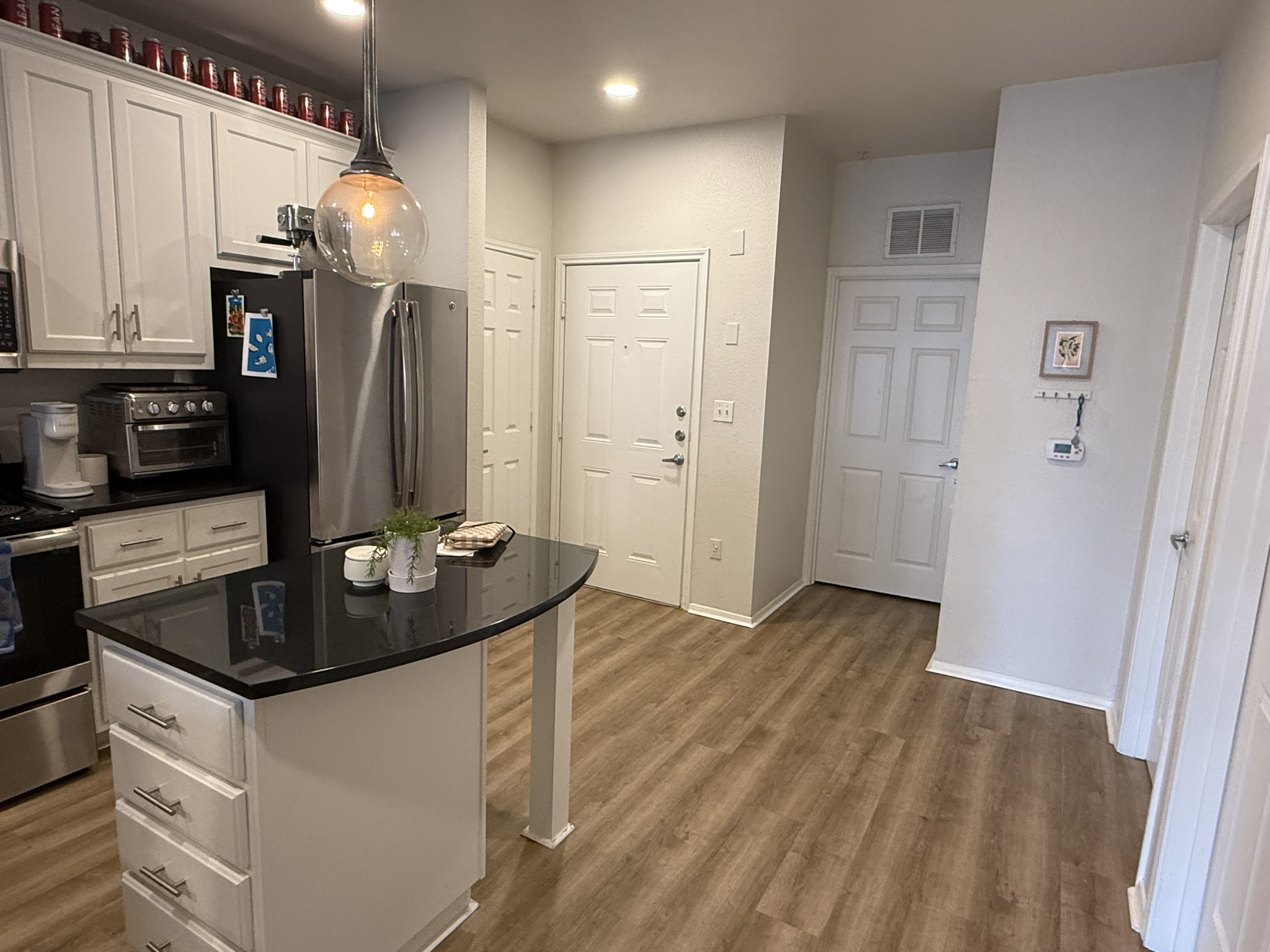 910 West 25th Street, Unit 508 Austin, TX 78705 - Photo 4 of 14 a kitchen with stainless steel appliances granite countertop a refrigerator and a sink