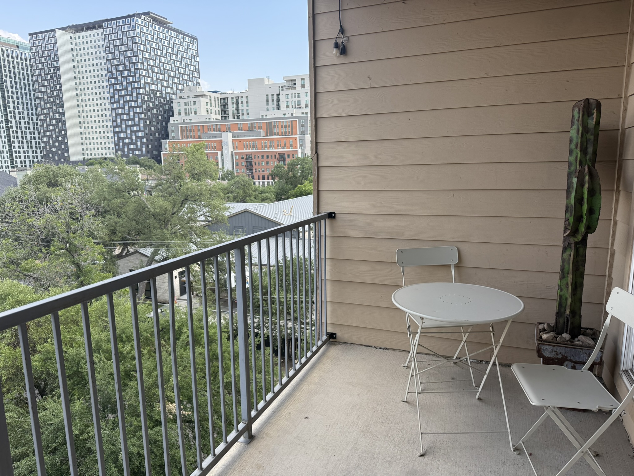 910 West 25th Street, Unit 508 Austin, TX 78705 - Photo 10 of 14 a view of a balcony with chair and a grill