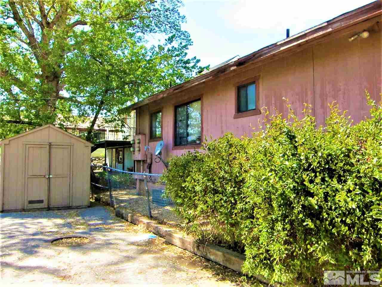 44 West 10th Street Reno, NV 89503 - Photo 13 of 27 a backyard of a house with yard and outdoor seating