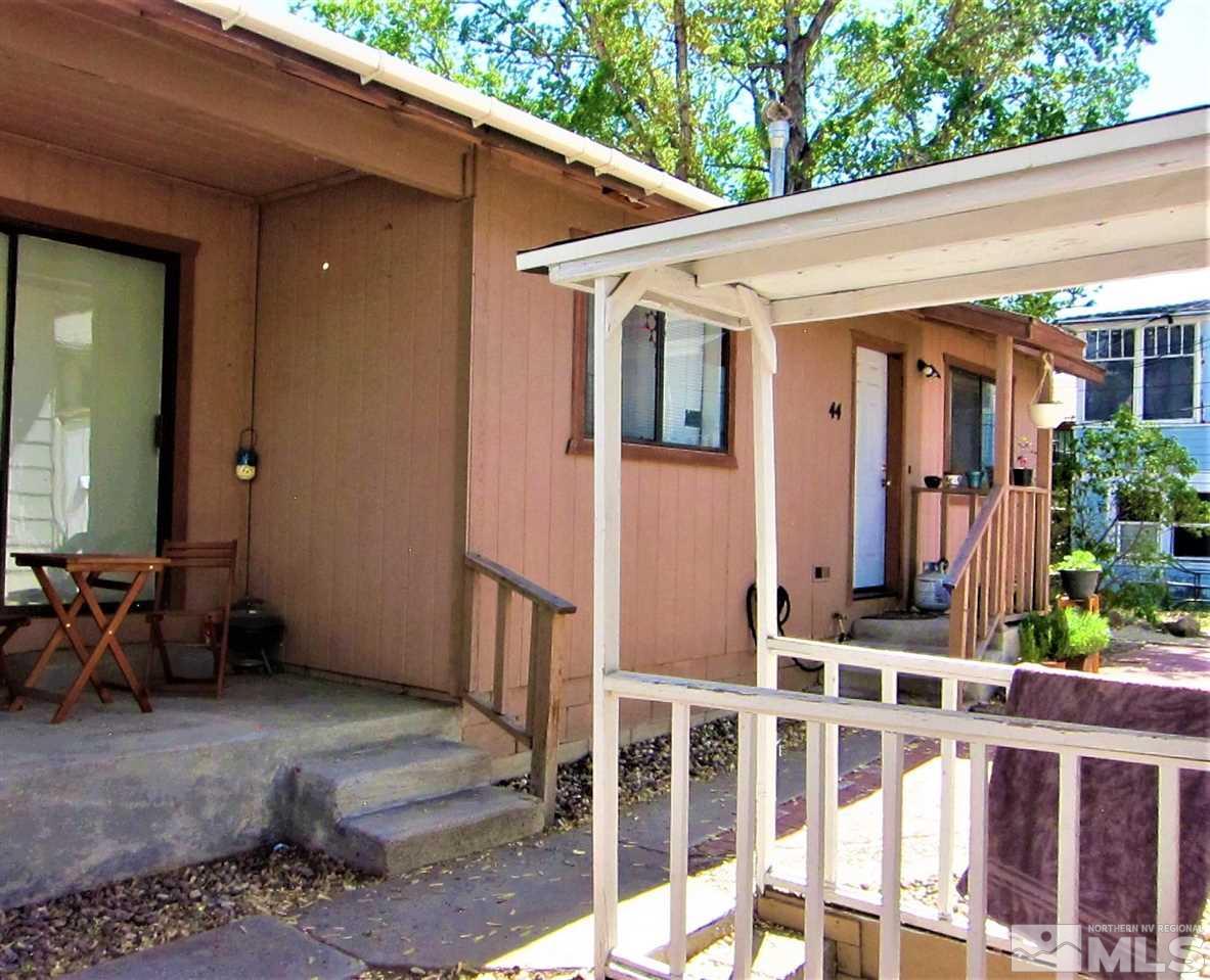 44 West 10th Street Reno, NV 89503 - Photo 5 of 27 a view of a house with large windows and flower plants