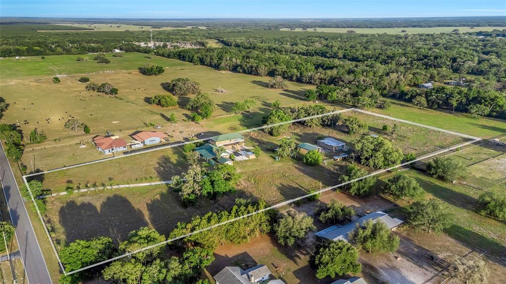 20138 Bowman Road Spring Hill, FL 34610 - Photo 3 of 40 an aerial view of residential houses with outdoor space